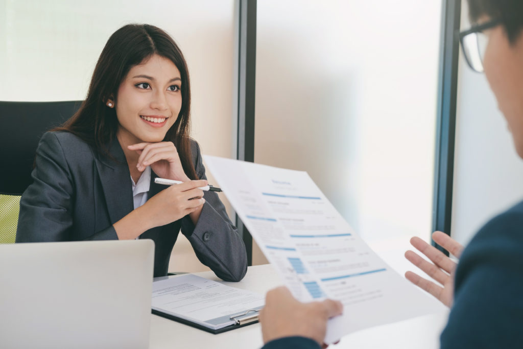 Business situation, job interview concept. Confident businessman in a job interview with a corporate personnel manager.